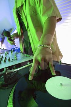 Royalty Free Photo of a DJ's Hand Spinning a Vinyl Record