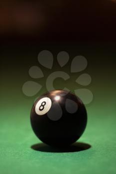 Royalty Free Photo of an Eight Ball on a Green Billiards Table