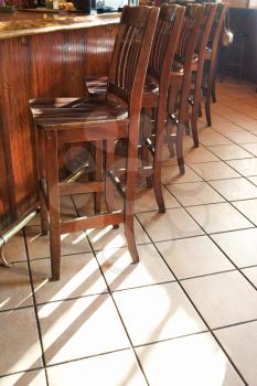 Royalty Free Photo of Chairs Lined Up at a Bar in a Nightclub of a Restaurant