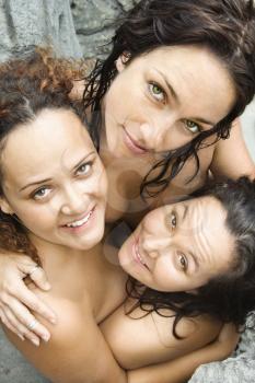 Royalty Free Photo of Three Nude Women Embracing Each Other Looking Up and Smiling
