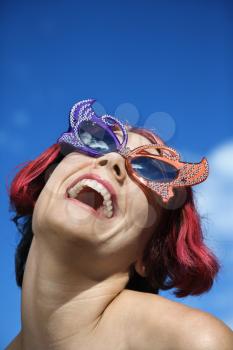 Royalty Free Photo of a Woman Wearing Unique Vintage Glasses