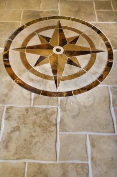 Royalty Free Photo of a Marble Floor With a Star Shape in an Affluent Home