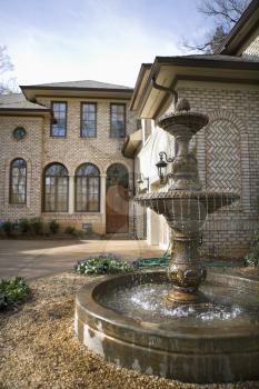 Royalty Free Photo of a Home With a Fountain