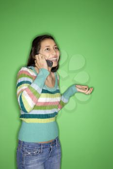 Royalty Free Photo of a Teen Girl Talking on a Cellphone and Smiling 