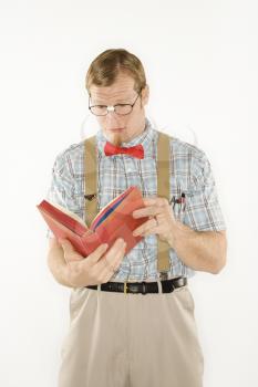 Royalty Free Photo of a Nerdy Man Reading a Book