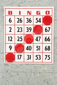 Royalty Free Photo of Red Bingo Card With Winning Chips