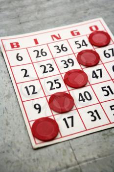 Royalty Free Photo of Red Bingo Card with Winning Chips