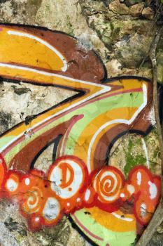 Royalty Free Photo of a Concrete Wall Covered With Graffiti 