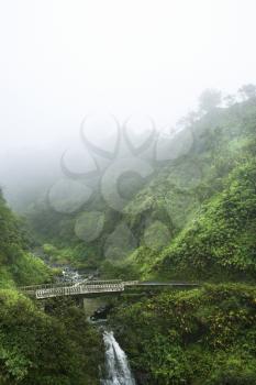 Royalty Free Photo of Mist Above a Waterfall on the Road to Hana, Hana Highway, Hawaii, USA