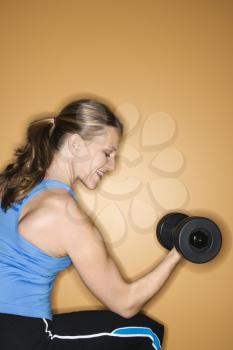 Royalty Free Photo of a Woman Lifting Hand Weights