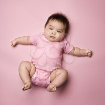 Royalty Free Photo of a Baby Lying on Her Back
