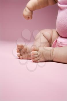 Royalty Free Photo of a Close-up of a Babies Legs, Feet and Arm