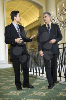 Royalty Free Photo of Businessmen Talking in a Hotel