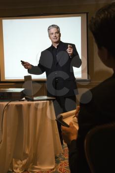 Royalty Free Photo of a Businessman Giving a Presentation