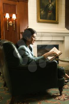 Royalty Free Photo of a Female Sitting and Reading