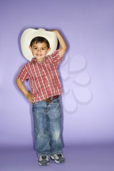 Royalty Free Photo of a Little Boy Wearing a Cowboy Hat