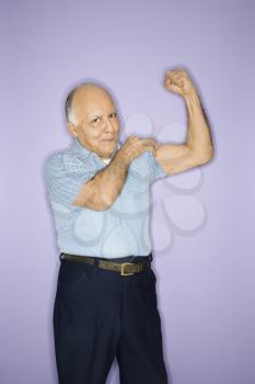 Royalty Free Photo of an Older Man Flexing