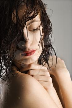 Royalty Free Photo of a Naked Attractive Redheaded Woman With Wet Hair and Skin