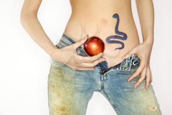 Royalty Free Photo of a Woman With a Snake Tattoo Holding an Apple