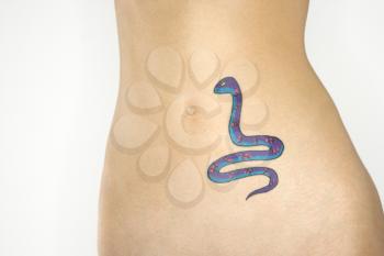 Royalty Free Photo of a Nude Young Woman With a Snake Tattoo