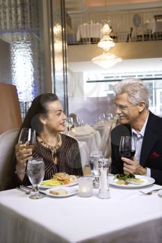 Royalty Free Photo of an Older Couple Dining at a Restaurant 