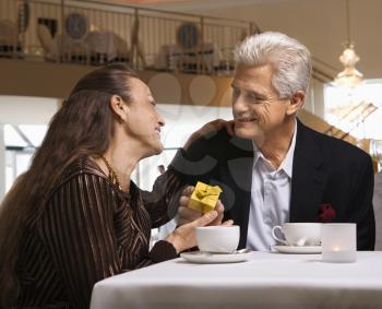 Royalty Free Photo of a Man Giving a Woman a Gift