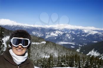 Royalty Free Photo of a Female Skier Posing on a Mountain