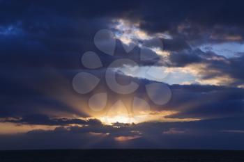 Royalty Free Photo of Sunbeams Coming Through Clouds at Sunrise Over Maui, Hawaii, USA