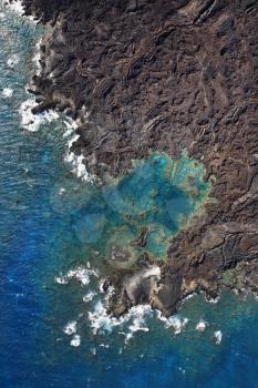 Royalty Free Photo of an Aerial of Pacific Ocean and Maui, Hawaii Coast With Lava Rocks