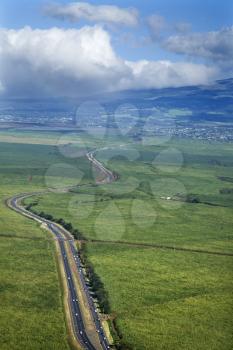 Royalty Free Photo of a Road Cutting Through a Cropland in Rural Maui, Hawaii