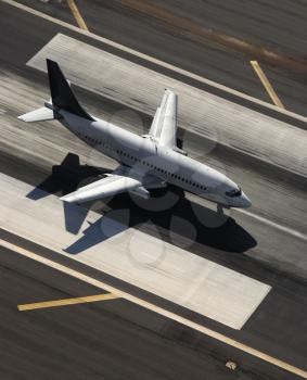 Royalty Free Photo of an Aerial View of a Passenger Airplane on an Airport Runway