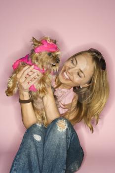Royalty Free Photo of a Woman Holding a Yorkshire Terrier Dog