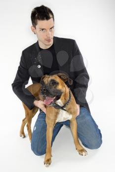Royalty Free Photo of a Man With a Boxer Dog