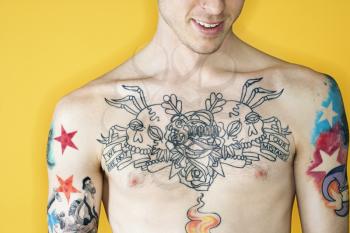 Royalty Free Photo of a Tattooed Man's Chest