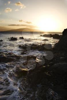 Royalty Free Photo of a Rocky Coast During Sunset in Maui Hawaii