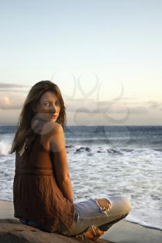Royalty Free Photo of a Woman Sitting on a Beach in Maui Hawaii 