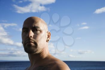 Royalty Free Photo of a Bald Male Portrait on a Beach