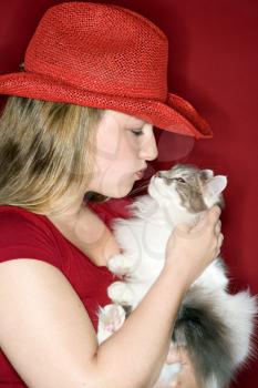 Royalty Free Photo of a Woman Kissing Her Cat