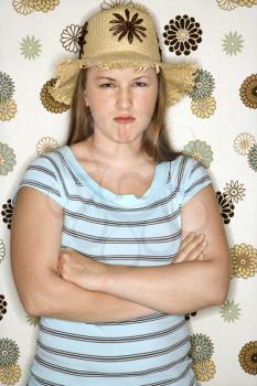 Royalty Free Photo of Young a Woman Pouting Wearing a Straw Hat