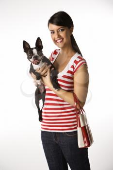 Royalty Free Photo of a Young Woman Holding a Boston Terrier Dog