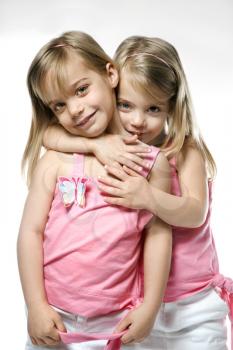 Royalty Free Photo of Twin Girls Hugging