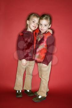Royalty Free Photo of Twin Girls Hugging 
