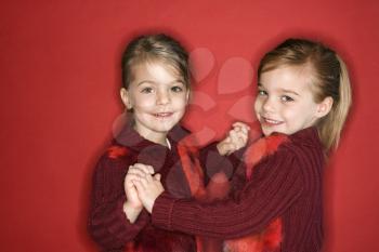 Royalty Free Photo of Twin Girls Dancing Together