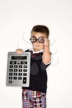 Royalty Free Photo of a Little Boy Wearing Glasses and Holding a Large Calculator