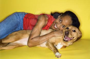 Royalty Free Photo of a Woman Hugging a Dog