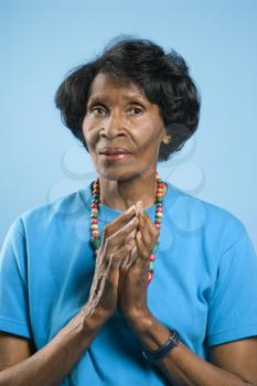 Royalty Free Photo of a Woman With Her Hands in a Prayer Position