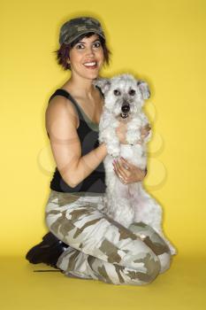 Royalty Free Photo of a Woman Holding a Dog