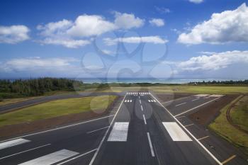 Royalty Free Photo of an Aerial View of an Airport Runway on the Coastline of Maui, Hawaii