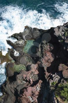 Royalty Free Photo of an Aerial View of Waves Crashing on Rocks in Maui, Hawaii