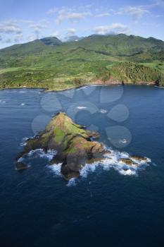 Royalty Free Photo of an Aerial of a Rock Jutting Out of the Pacific Ocean Off the Coast of Maui, Hawaiiou